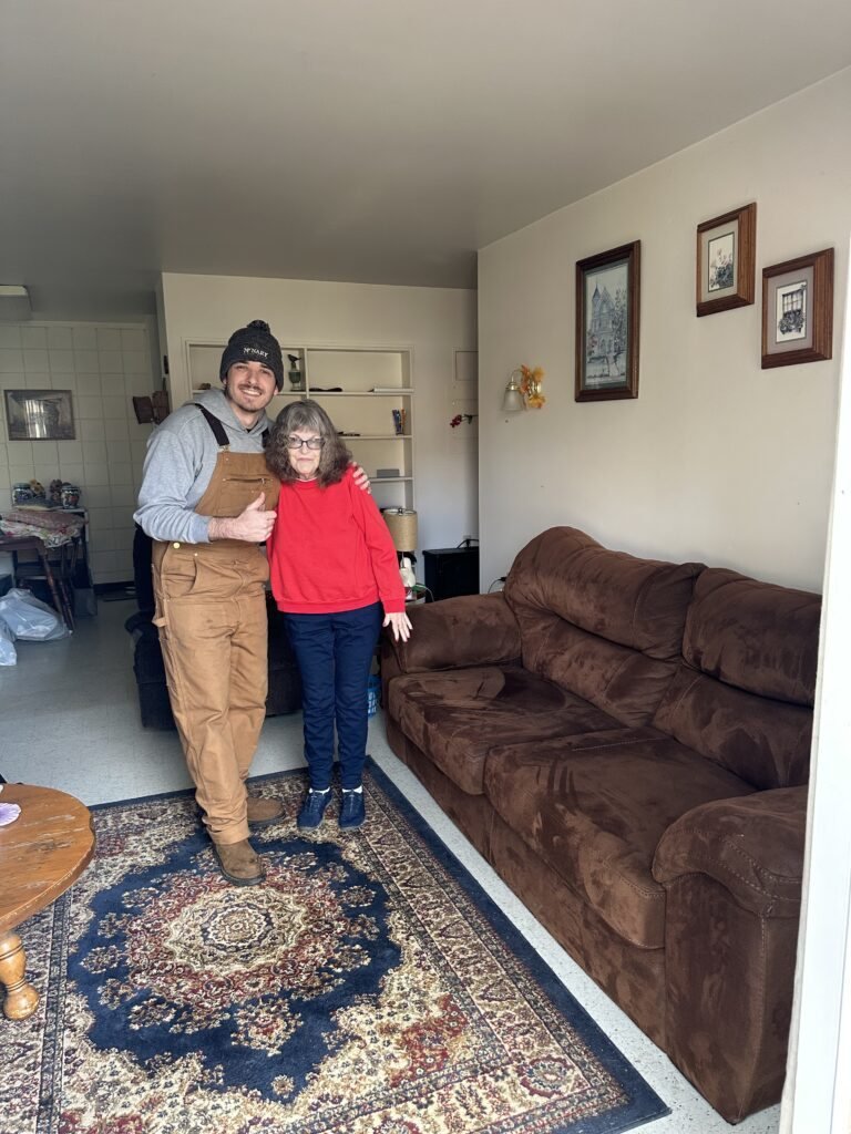 Eddie Zinda of EZ Junk and Hauling with a customer after a Salem living room cleanout